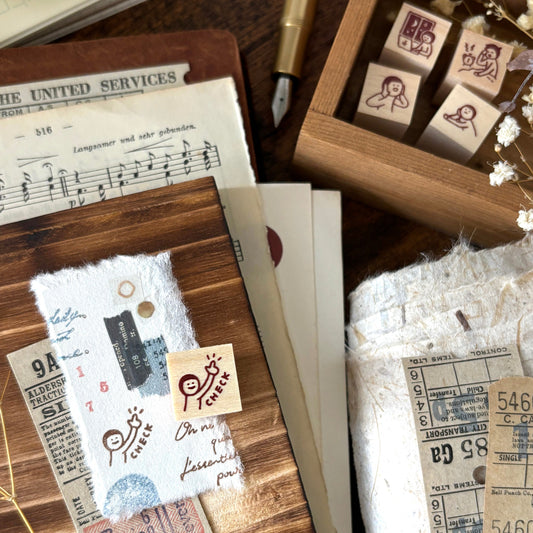 Wooden stamp with 'check' design