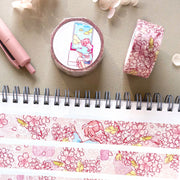 Washi tape with cherry blossom design on a notebook