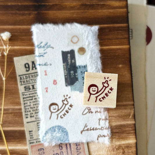 Wooden stamp with 'check' design 