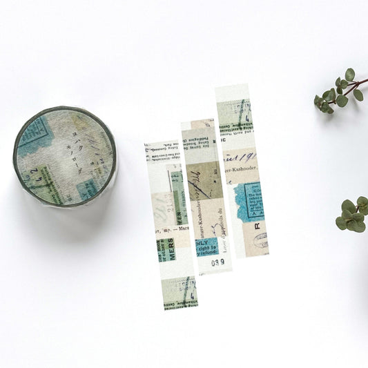 Decorative bookmarks with vintage design on a white surface with a plant.
