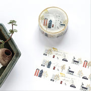 Decorative washi tape with small town design on a white surface