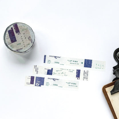 Round metal container with printed labels on a white background