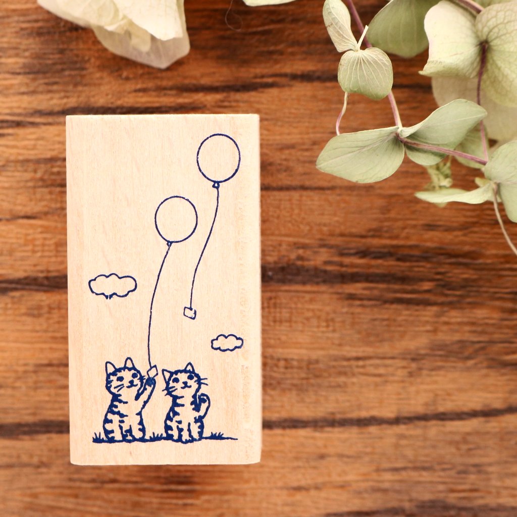 Cute cats with balloons rubber stamp great for your letters, traveler's notebook, planner, journal and lots more.  Available at Cute Things from Japan.