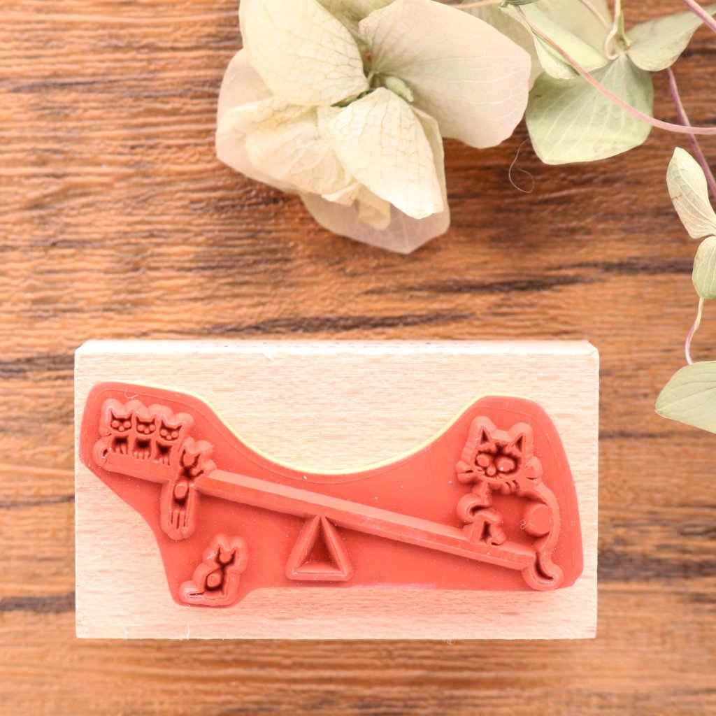 Cute Pottering Cat cats doing seesaw rubber stamp great for your letters and craft project.  Available at Cute Things from Japan.