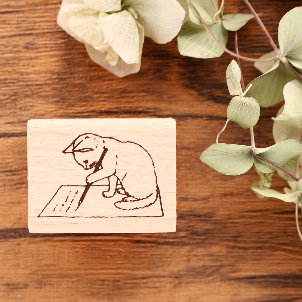 Cute Pottering letter writing cat rubber stamp for your traveler's notebook, hobonichi, planner and journal.  Available at Cute Things from Japan.