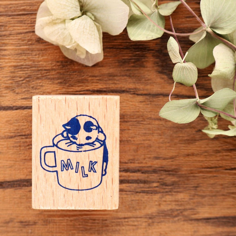 Cute Pottering Cat drinking milk cat rubber stamp great for your letters and craft project.  Available at Cute Things from Japan.