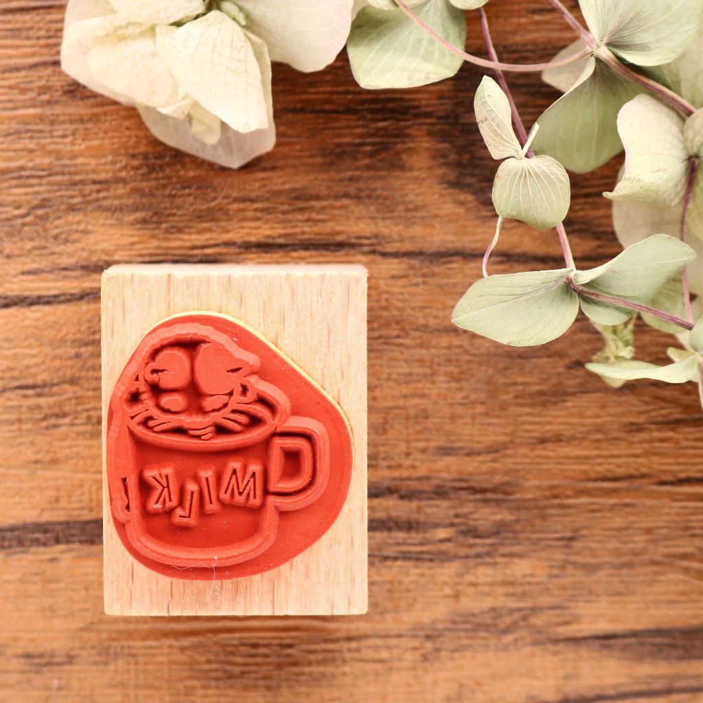 Cute Pottering Cat drinking milk cat rubber stamp great for your letters and craft project.  Available at Cute Things from Japan.