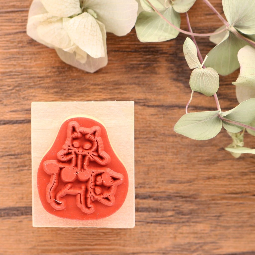 Cute Pottering Cat playing leapfrog rubber stamp great for your letters and craft project.  Available at Cute Things from Japan.