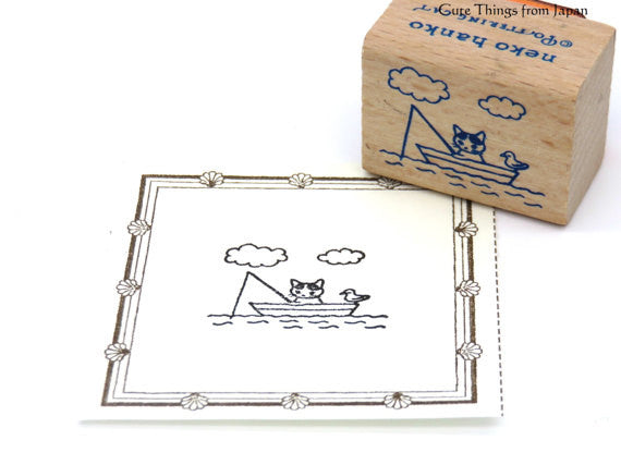 Cute Pottering Cat fishing rubber stamp for your traveler's notebook, hobonichi, planner and journal.  Available at Cute Things from Japan.